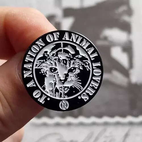 CONFLICT / コンフリクト / CONFLICT CIRCLE ENAMEL PIN (TO A NATION OF ANIMAL LOVERS)